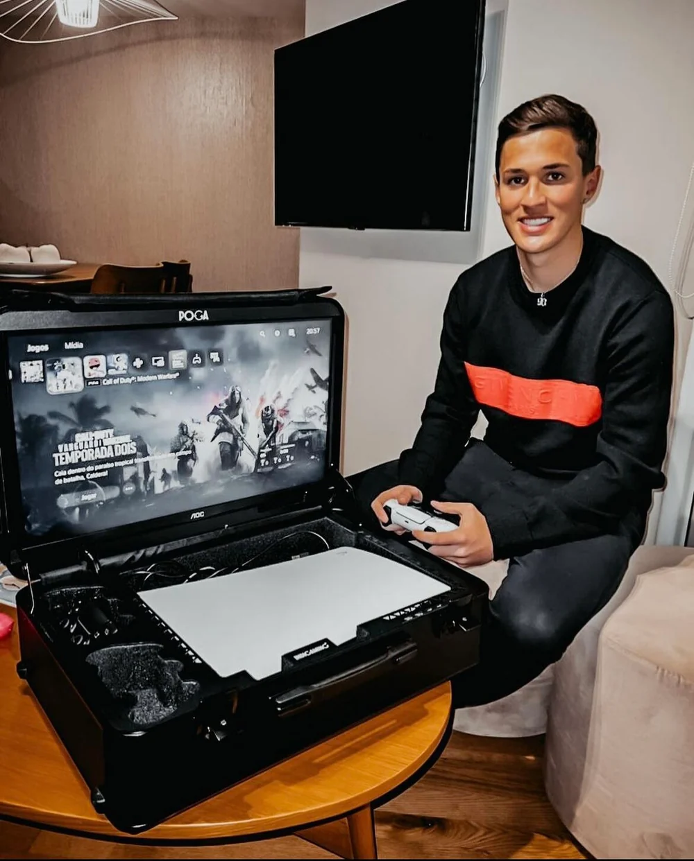 Gamer using a POGA portable gaming station at home