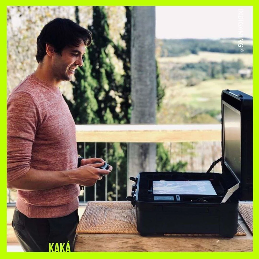 Kaká gaming on a POGA portable gaming station outdoors