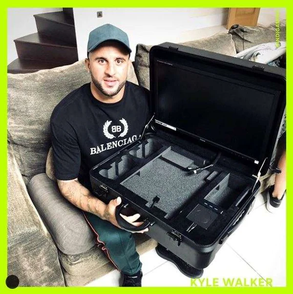 Kyle Walker holding an open POGA portable gaming station