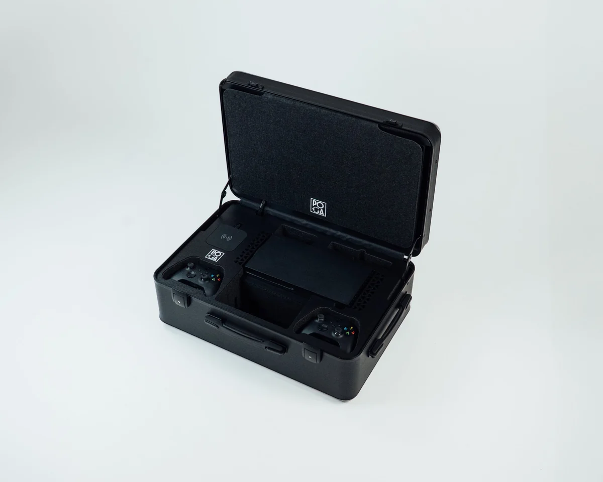 Open POGA SLY travel case with an Xbox Series X console and two controllers