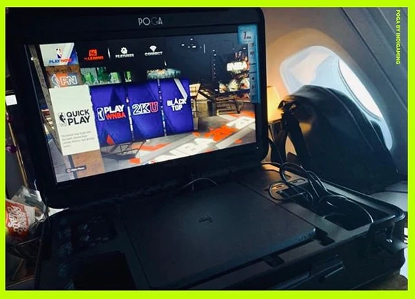 POGA portable gaming station in an airplane cabin