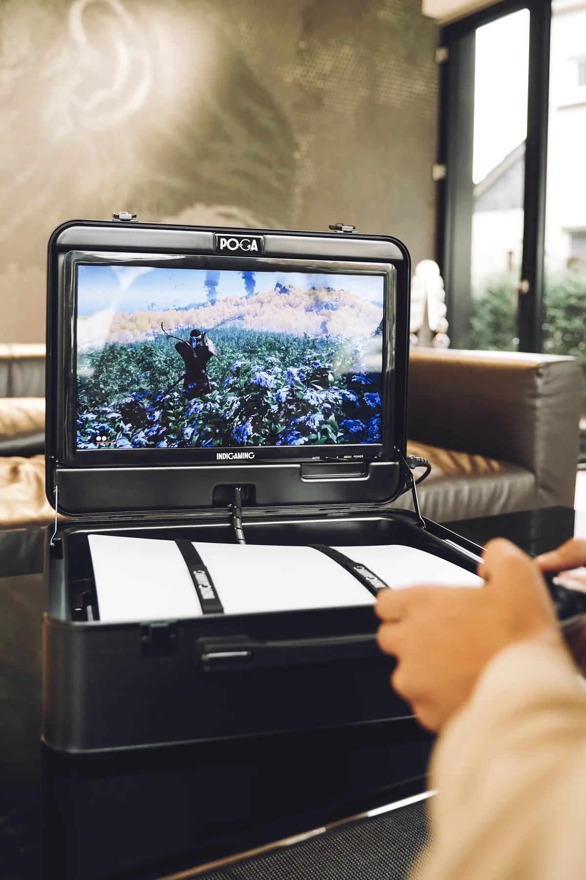 Portable gaming station air travel ready - POGA Arc open case displaying gaming setup