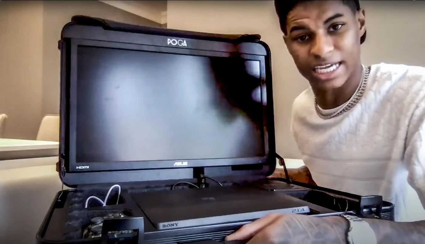 Gamer demonstrating a POGA portable gaming station