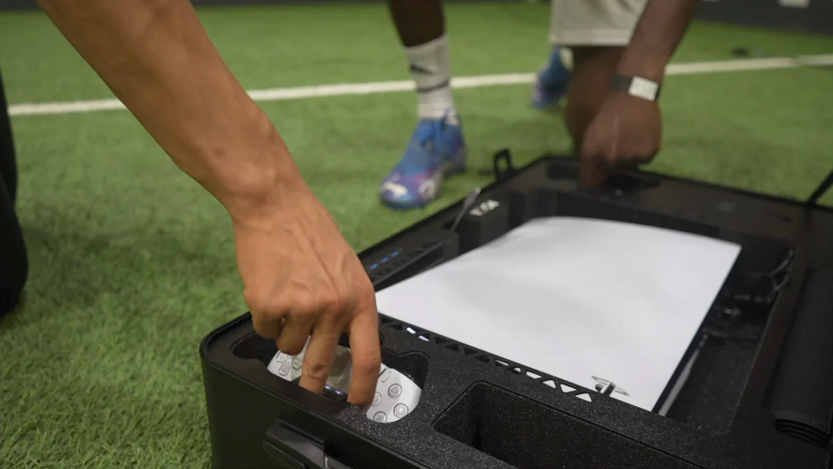premium PS5 gaming case — POGA YEZ player interaction showing wireless controller and storage